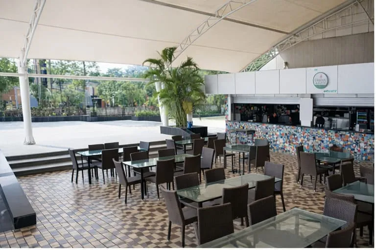 Outdoor seating deck under the canopy at Urban Rasoi